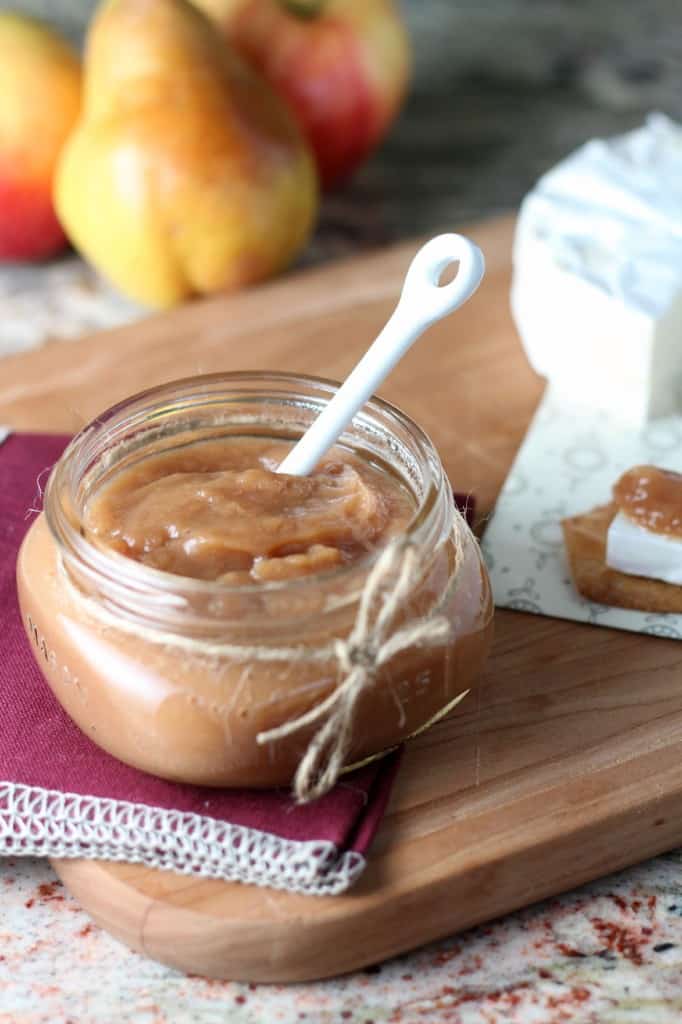 pear-apple butter in small mason jar with white spoon
