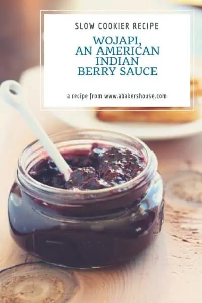 Wojapi, an American Indian berry sauce, in a wide mouth mason jar with white spoon