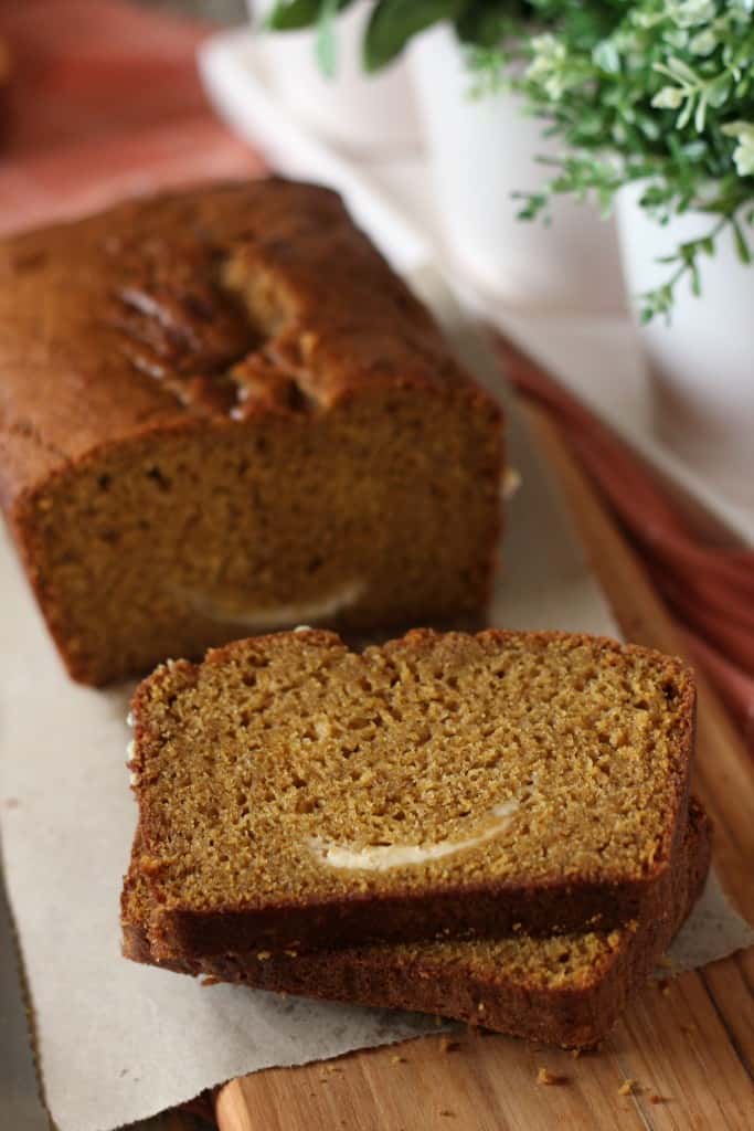 pumpkin-bread-with-cream-cheese sliced on white plate