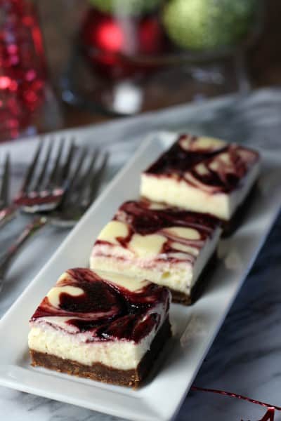 three ginger-cherry-cheesecake-squares_on a plate