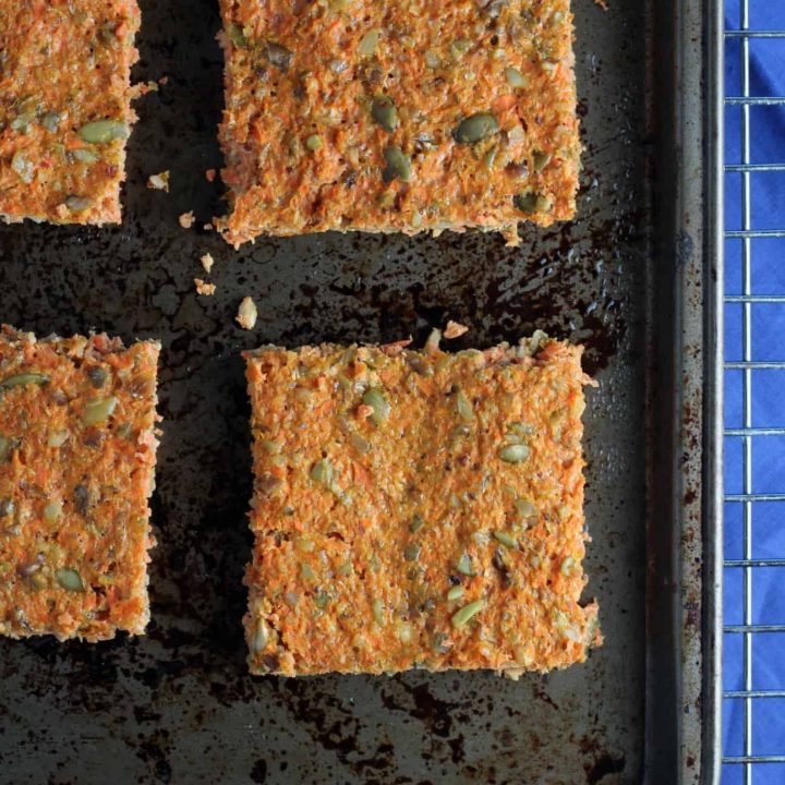 carrot flatbread on a baking pan with blue napkin