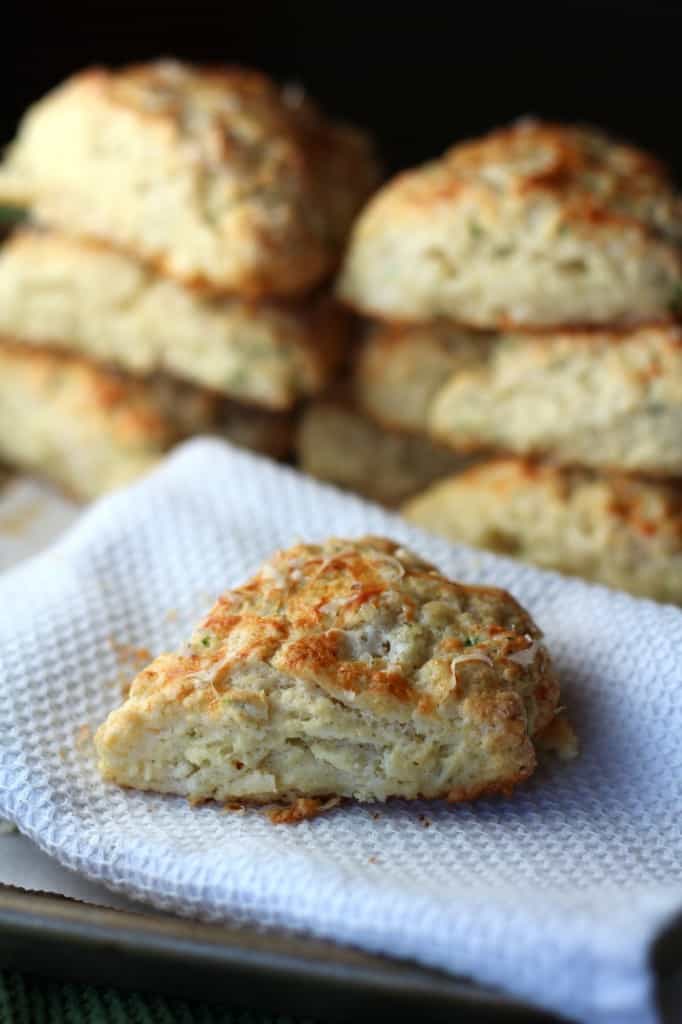 cheese scones with chives on a white towel 