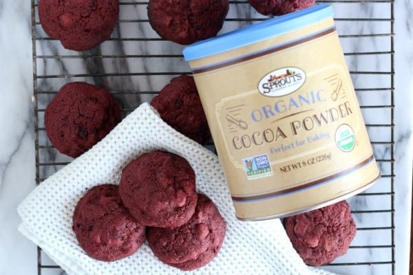 chocolate chip beet cookies on wire baking rack with jar of cocoa powder