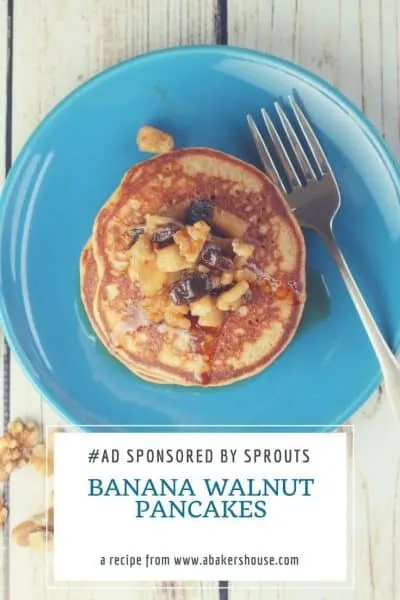 Stack of banana walnut pancakes on blue plate with silver fork