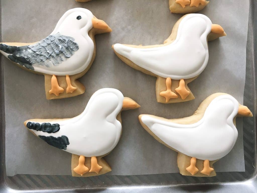 sugar cookie seagull cookies decorated in steps with royal icing