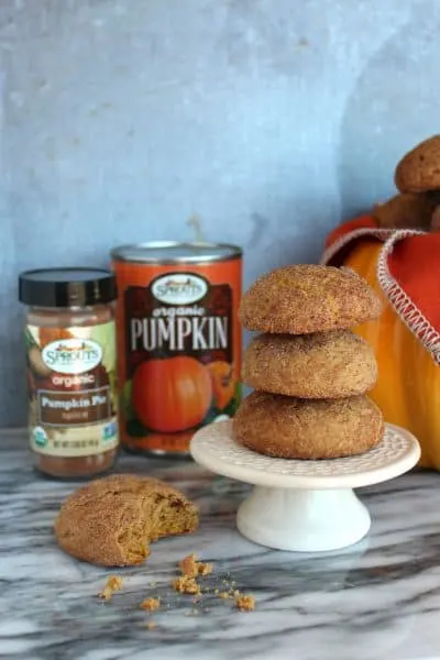 pumpkin snickerdoodles in a stack with can of pumpkin puree