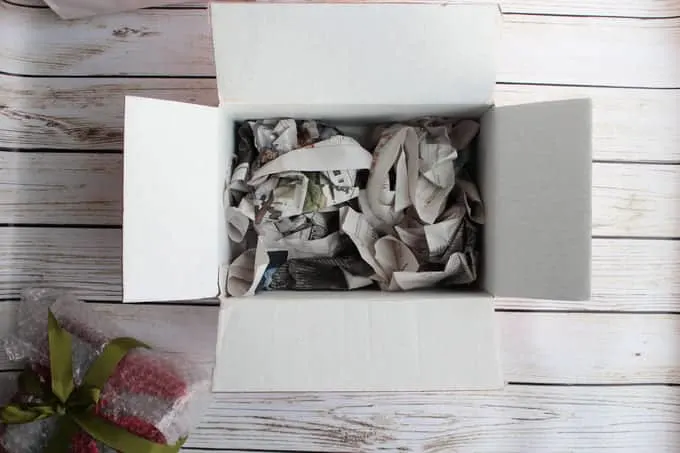 Newspaper crumpled in the bottom of a box