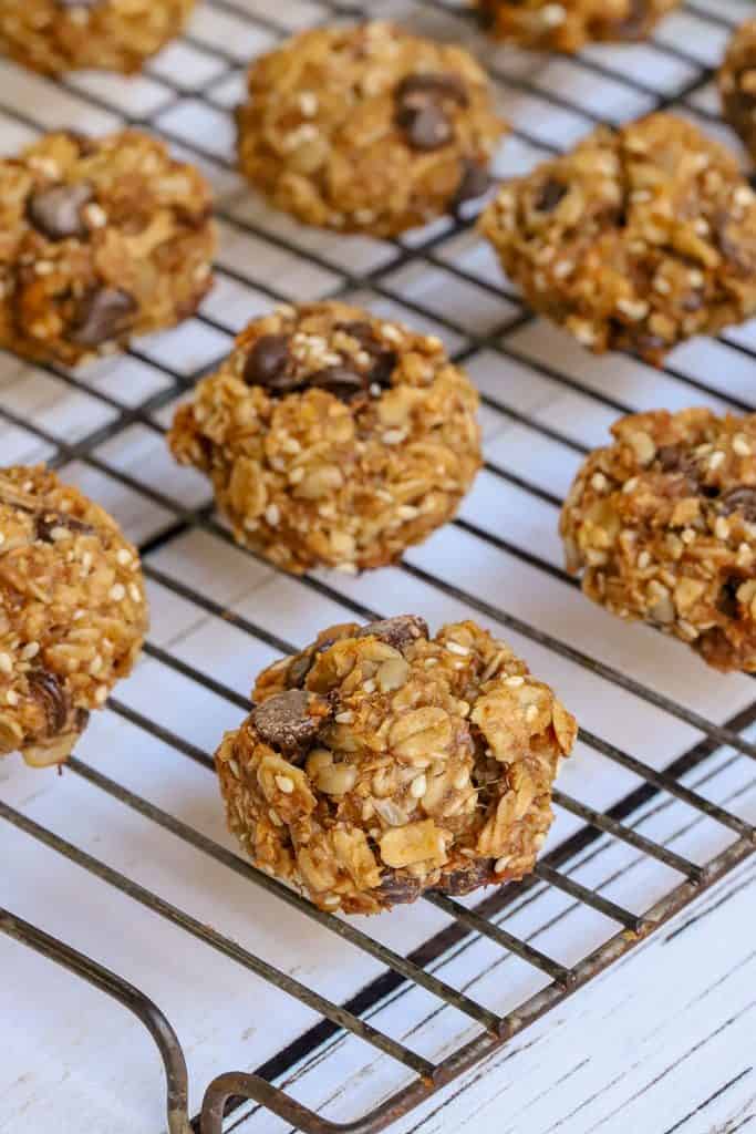 Breakfast cookies with granola, peanut powder and dates on wire rack