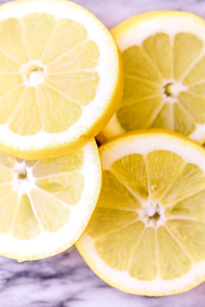Slices of lemon on a marble countertop