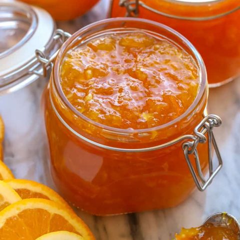 Jar filled with orange lemon marmalade