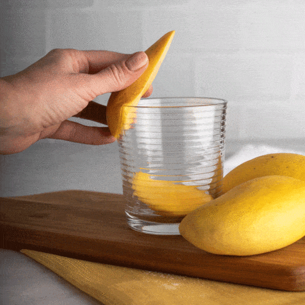 GIF showing how to cut an Ataulfo mango with a glass
