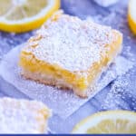 Lemon squares with lemon slices on marble board