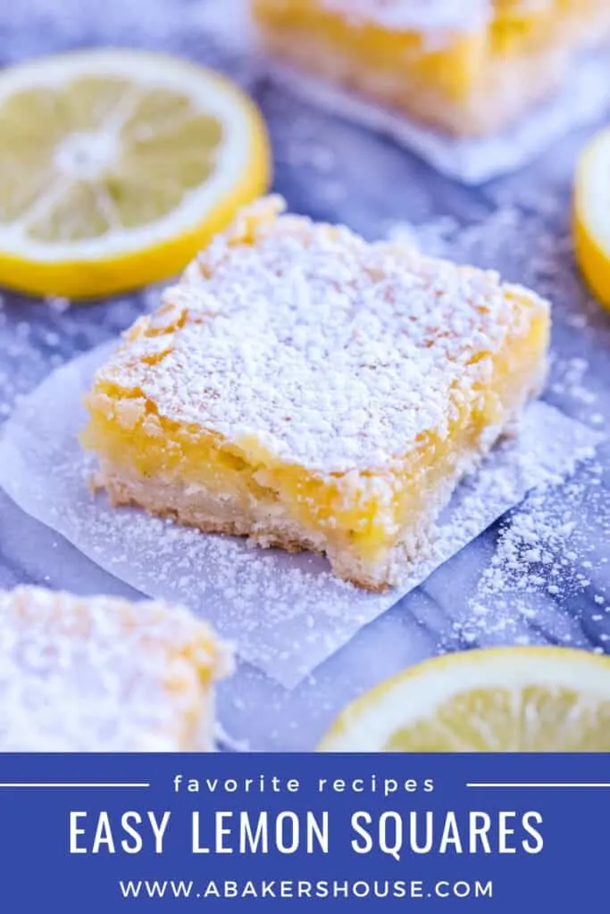 Lemon squares with lemon slices on marble board