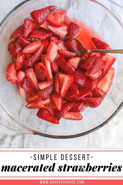 bowl of macerated strawberries on a marble surface