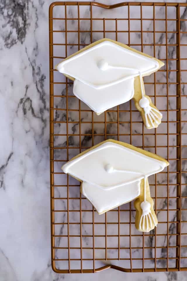 Graduation cookies step 6 decorating with white royal icing