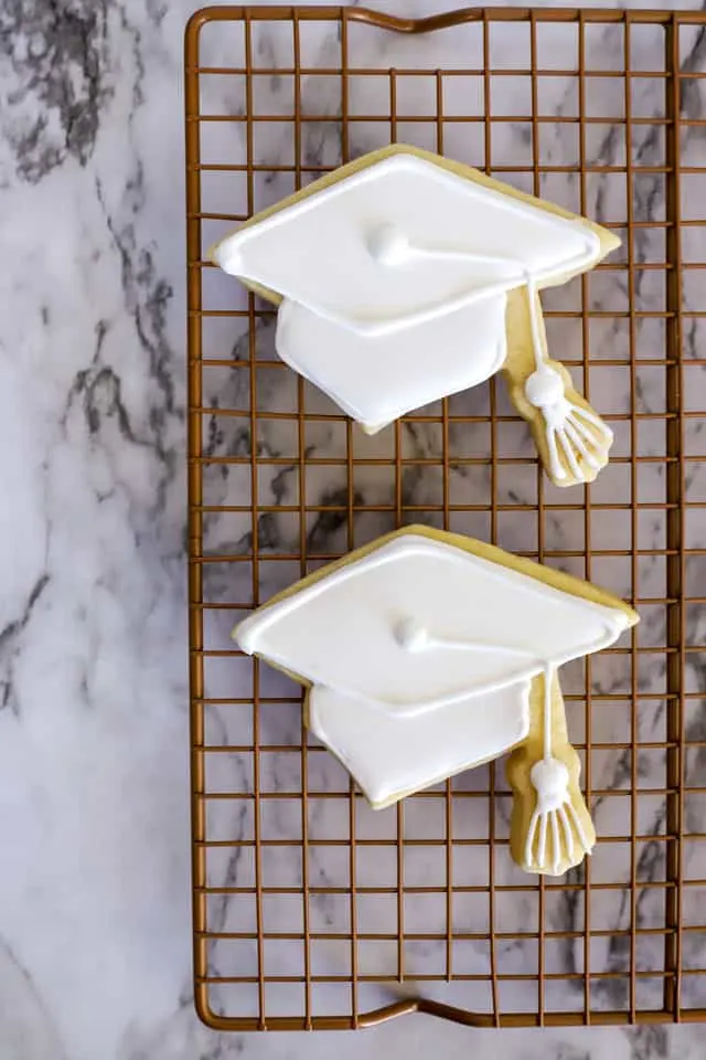 Graduation cookies step 6 decorating with white royal icing