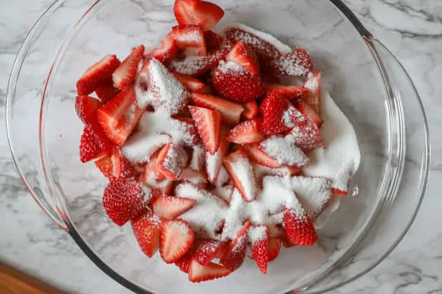 Sugar added to fresh berries for macerated strawberries