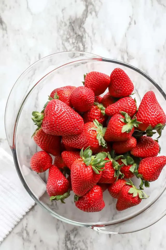 Fresh strawberries in a glass bowl