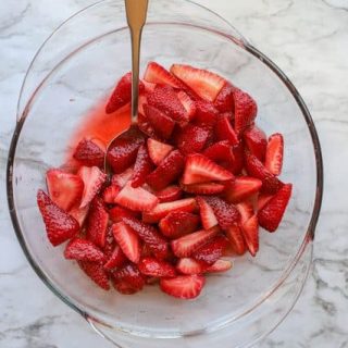 Beautiful macerated strawberries in bowl after sitting overnight