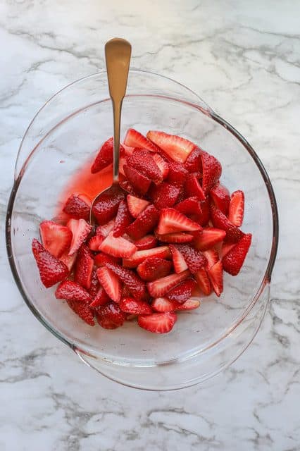 Beautiful macerated strawberries in bowl after sitting overnight