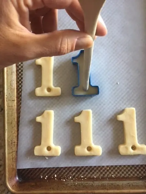Make a hole using a spoon in your cookies