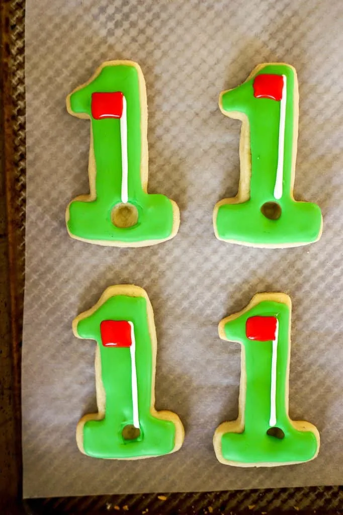 red golf flag on green hole in one cookies