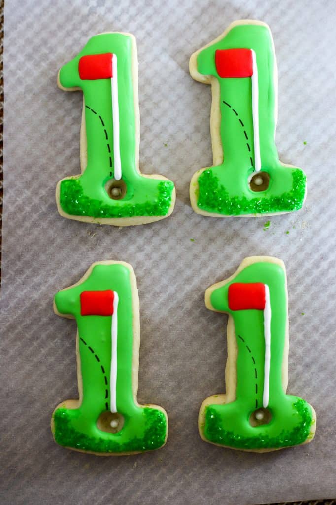 Green sparkles add texture for grass on these cookies