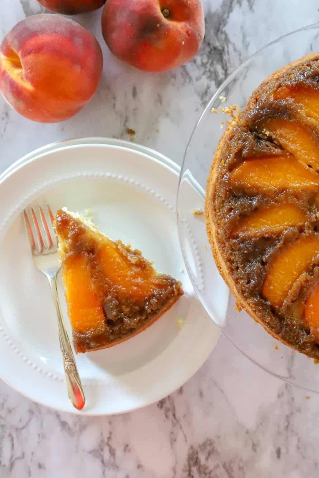 overhead photo of slice of upside down peach cake