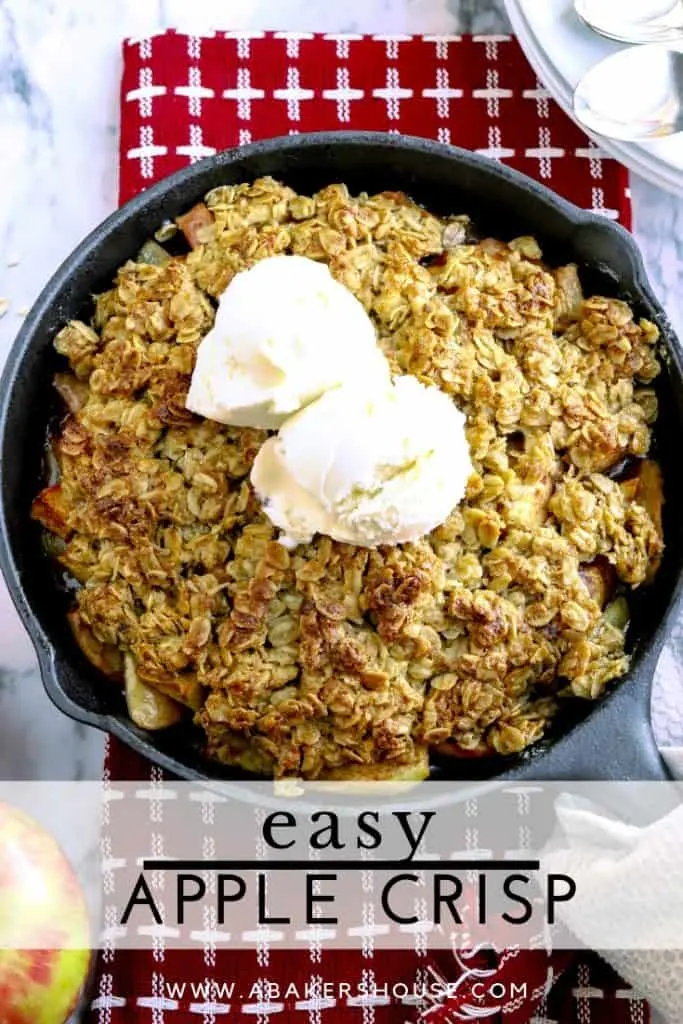 Pinterest image for apple crisp in cast iron skillet on red napkin