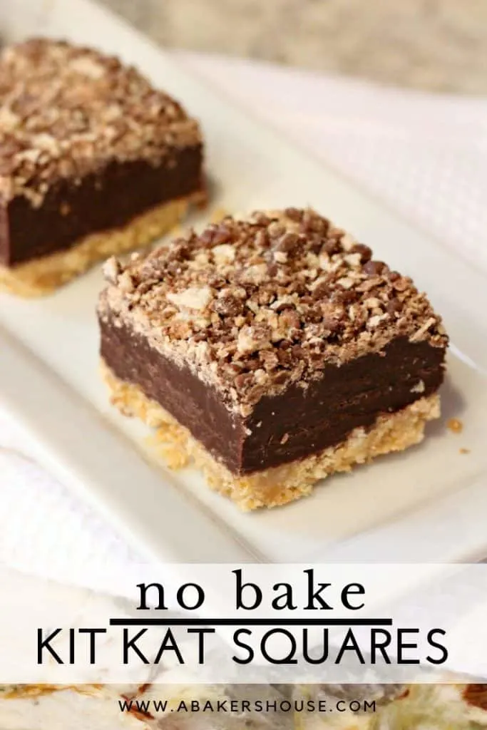 Kit kat square layered no bake dessert on a white plate