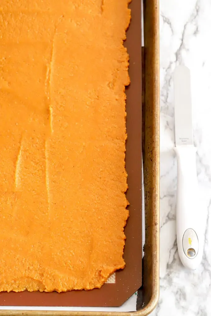 Pumpkin Fruit leather mixture spread out on a pan before baking