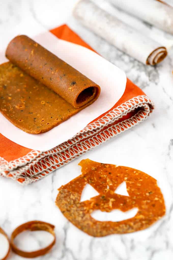Pumpkin fruit leather with pumpkin jack o laterns cut out with cookie cutters
