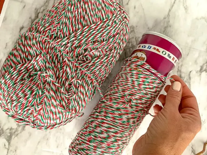 Yarn is wrapped around a Pringles can for an easy decoration and craft
