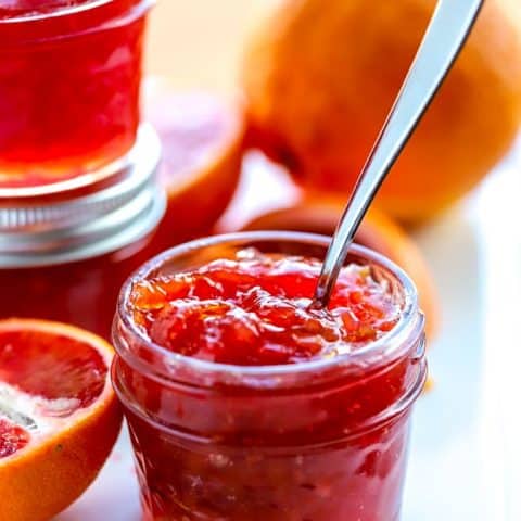 How to make blood orange marmalade in a mason jar on a white platter