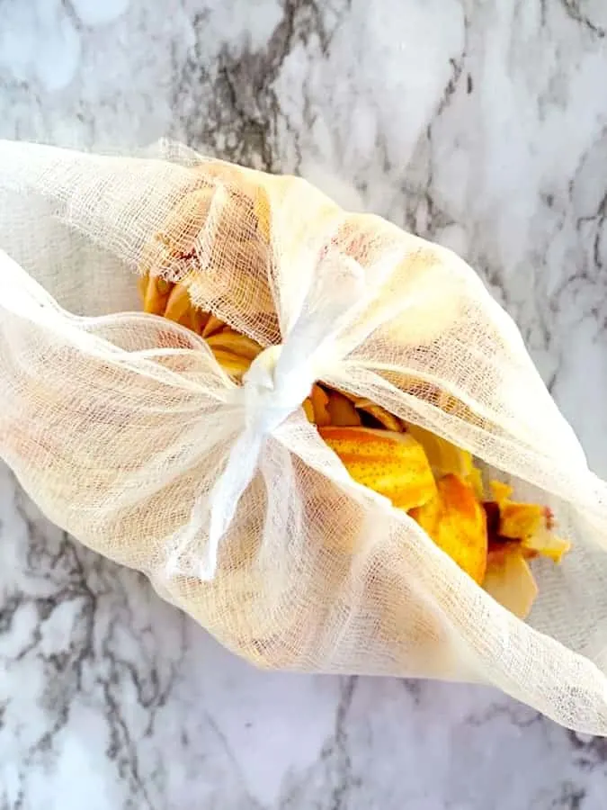 cheesecloth with orange peels and seeds for making jam