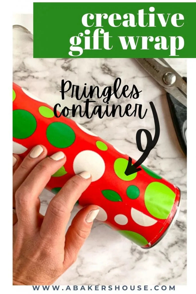 hand resting on gift wrapped pringles container