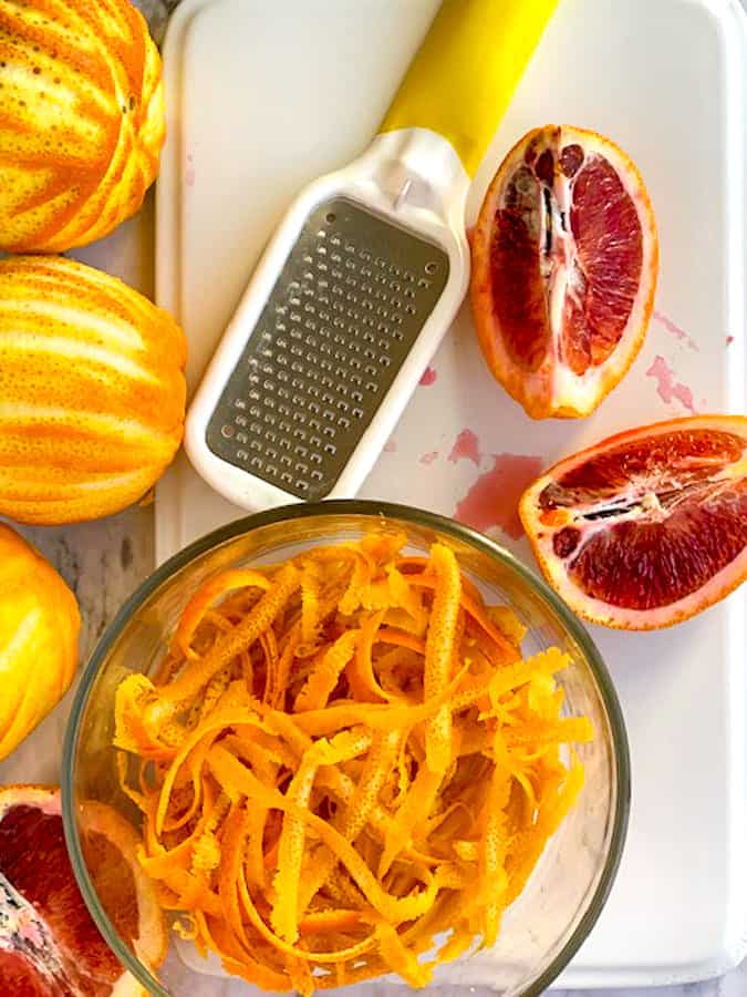 Zest of oranges and lemons in a glass bowl