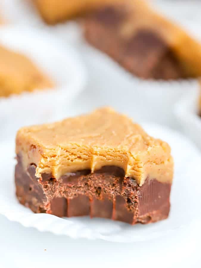 One square of chocolate peanut butter fudge with a bite taken out