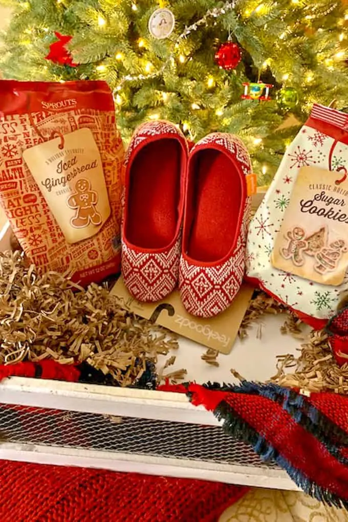 cookies and slippers in a container for gift basket