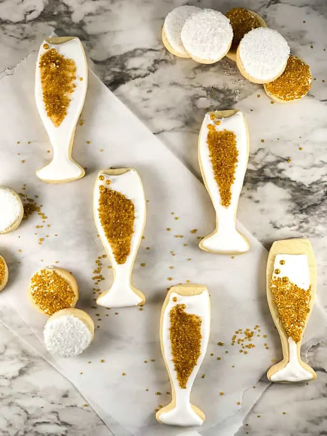 New Years Eve cookies in gold and white royal icing
