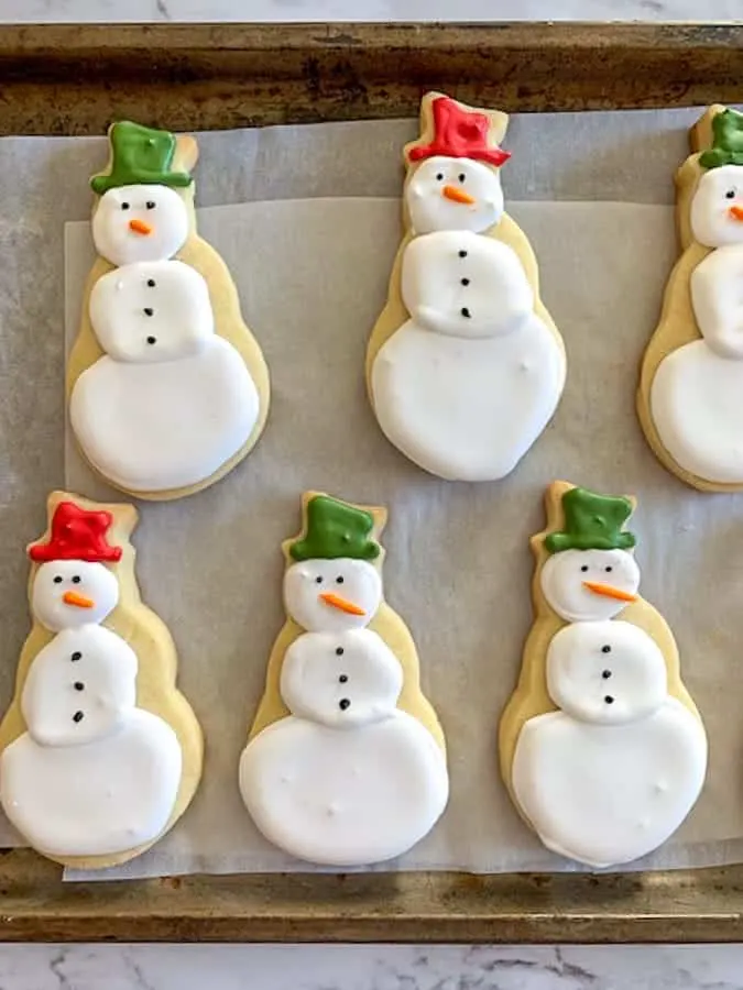 Adorable snowman cookies with royal icing decorations
