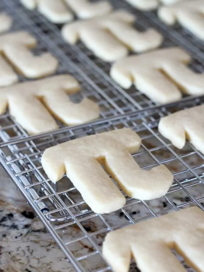 Happy Pi Day with greek letter pi day cookies on a wire cooling rack