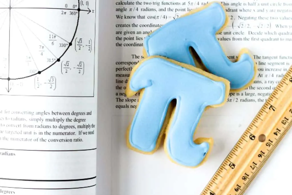 pi cookie on a book with a ruler
