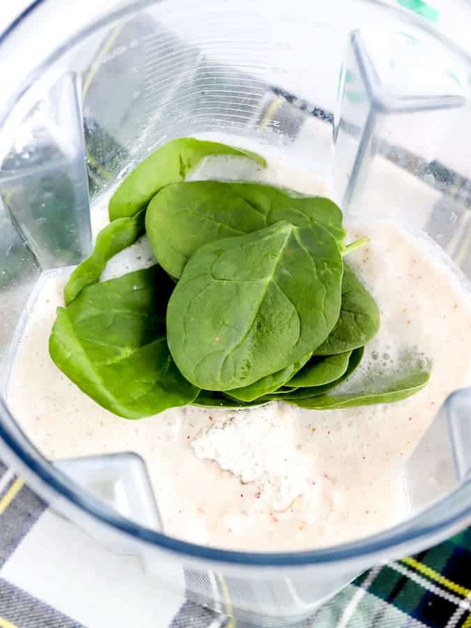 Ingredients for spinach pancakes in a Vitamix blender
