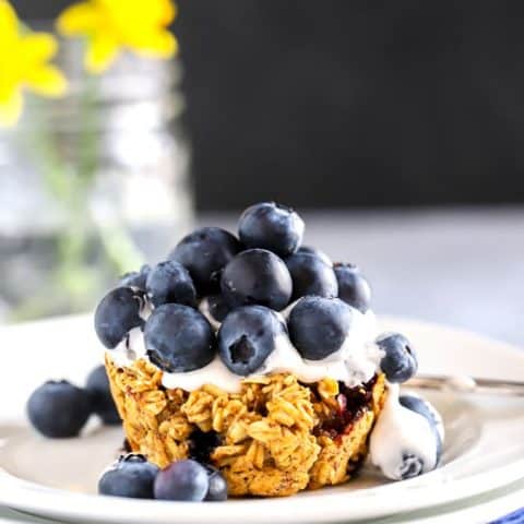 Blueberry baked oatmeal cup with cocowhip topping and blueberries for dessert