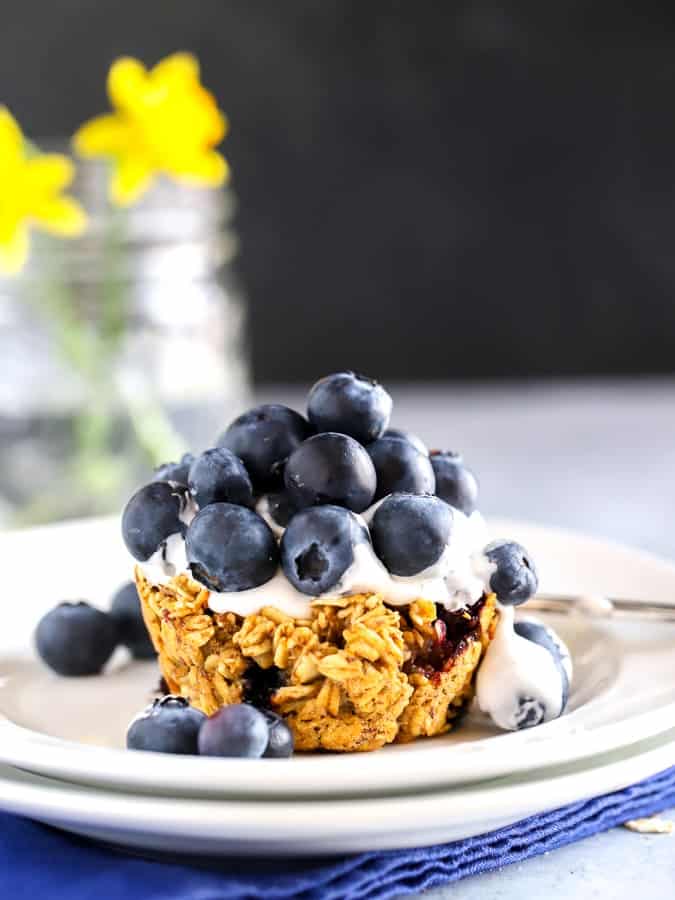 Blueberry baked oatmeal cup with cocowhip topping and blueberries for dessert