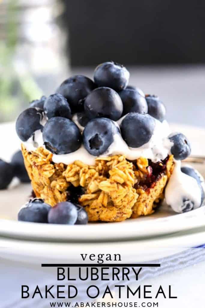 Mounds of blueberries atop a baked blueberry oatmeal cup with cocowhip topping for dessert