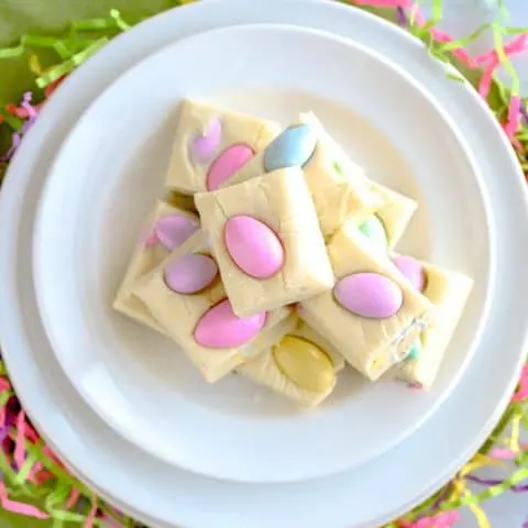 Easter white chocolate fudge stacked on a white plate