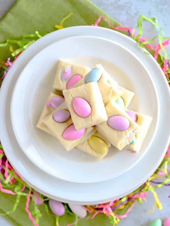 Easter white chocolate fudge stacked on a white plate