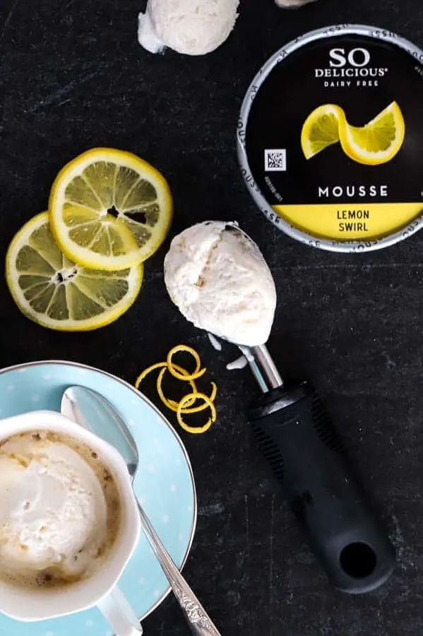 Overhead photo on black background of So Delicious Lemon Swirl Mousse and tea affogato